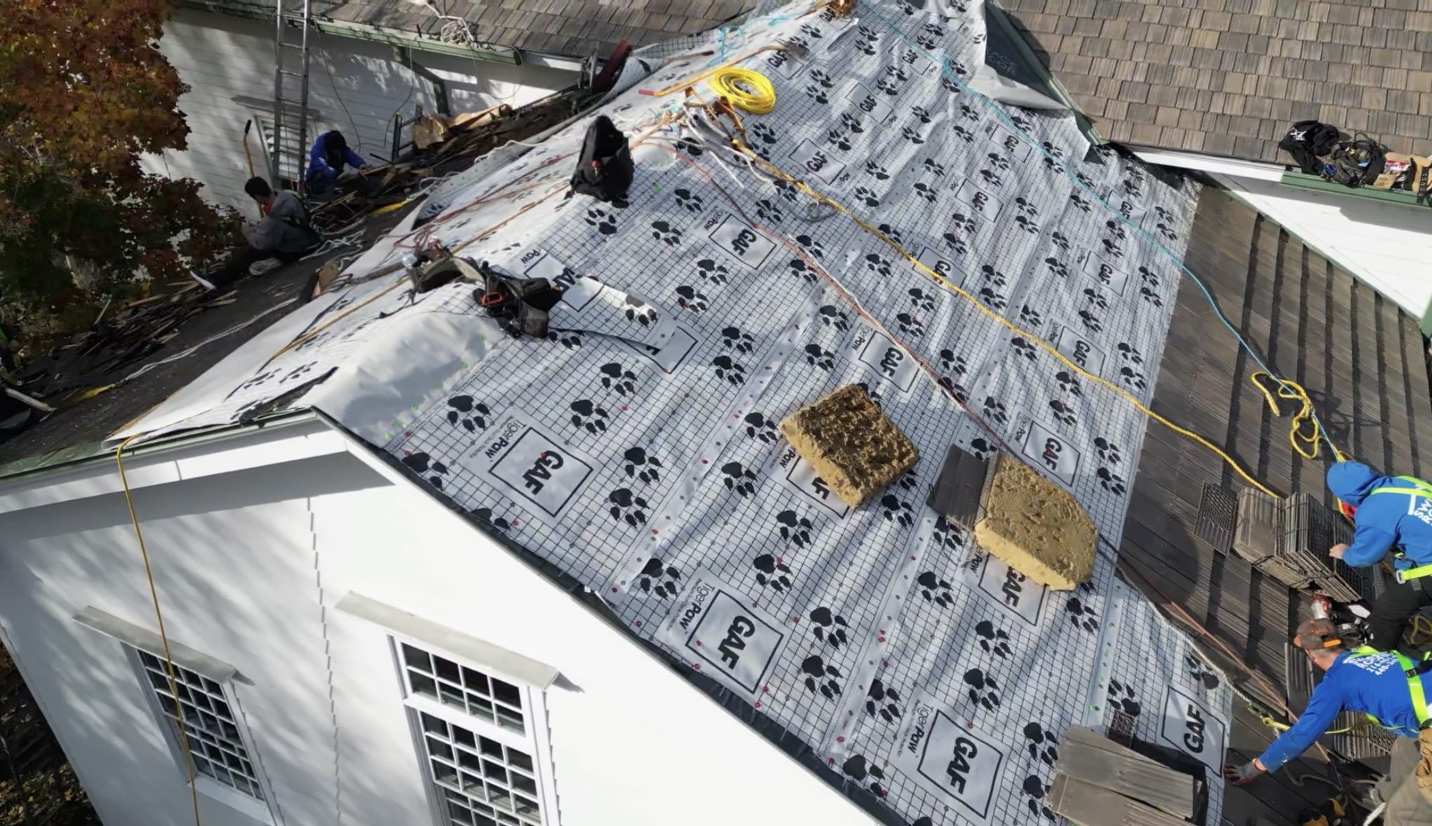 Real roofing project showing underlayment and installation work in progress